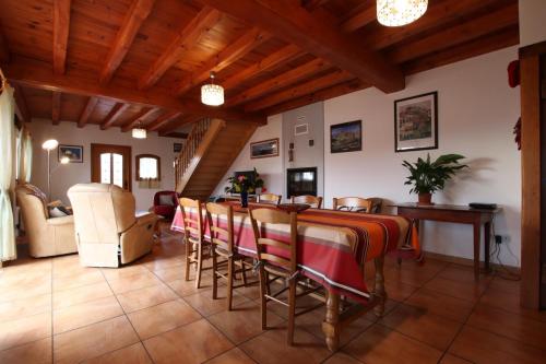 a dining room with a table and chairs at Suraya in Bidarray