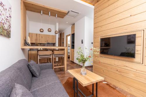 a living room with a couch and a table at Hotel Ramonda in Boljevac