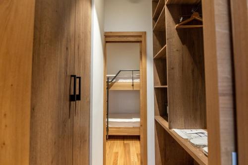 a room with a closet with a bunk bed at Hotel Ramonda in Boljevac