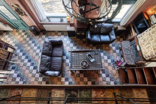 an overhead view of a living room with leather seats at Dream Chalet Trikala in Tríkala