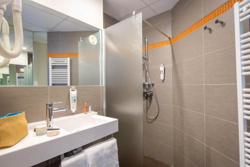 a bathroom with a sink and a shower at B&B HOTEL Marseille Centre La Timone in Marseille