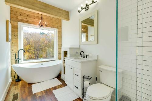 A bathroom at Modern Appalachian Vacation Rental with River Access