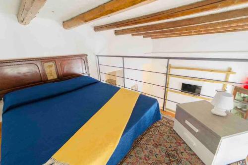 מיטה או מיטות בחדר ב-Archimede Suite Apartment - Morici Street