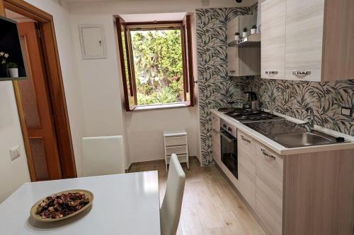 a kitchen with a plate of food on a table at Love House sul mare in Cetara