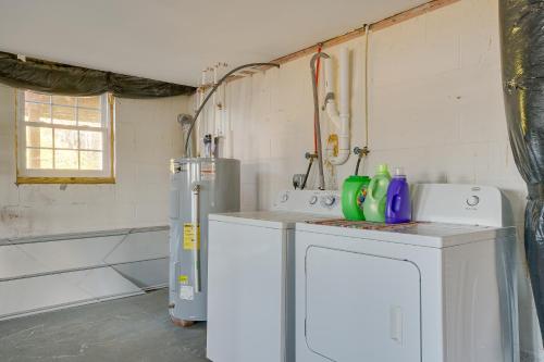 a kitchen with a washing machine and a sink at Cozy Lakefront Cabin in Semora with Large Dock! in Semora