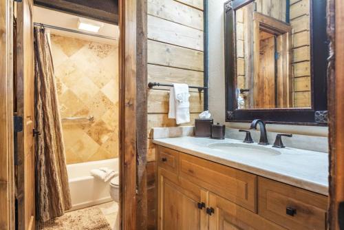 a bathroom with a sink and a toilet and a tub at West Vail Interlochen Condo B8 in Vail