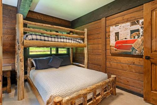 a bedroom with two bunk beds in a cabin at West Vail Interlochen Condo B8 in Vail