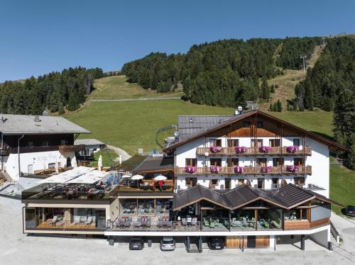 an aerial view of a hotel in the mountains at Berghotel Schlemmer in Bressanone