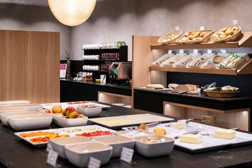 a buffet line with many different types of food at Berghotel Schlemmer in Bressanone