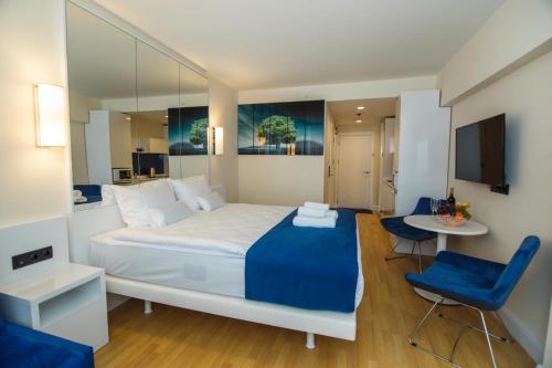 Postelja oz. postelje v sobi nastanitve Orbi City Hotel apartment Batumi