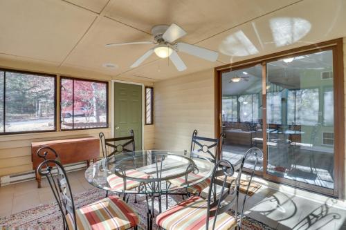 a dining room with a glass table and chairs at Spacious Family Home with Deck at Massanutten Resort in McGaheysville