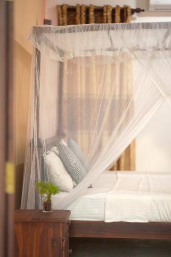 Postel nebo postele na pokoji v ubytování Surf Orchid Villa
