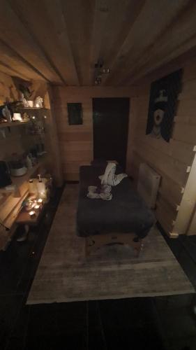a small room with a bed and a desk at Apartments Beskydy in Prostřední Bečva