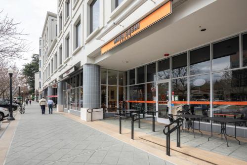 a store front of a building with people walking on a sidewalk at DT Mountain View 2BR w Pool Gym Parking Patio SFO-170 in Mountain View