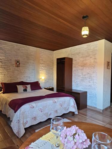 Ένα ή περισσότερα κρεβάτια σε δωμάτιο στο Pousada Encanto da Serra