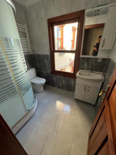 a bathroom with a shower and a toilet and a sink at Bosphorus view Lux willa in Istanbul