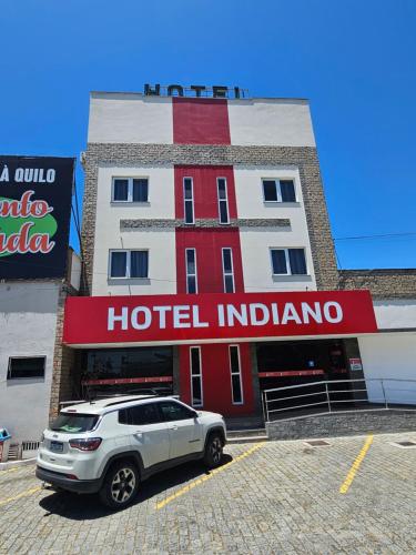 a car parked in front of a hotel indiana at HOTEL INDIANO in Rio Bonito