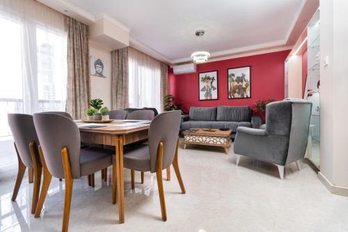 a dining room with a table and chairs at City Center Charm Apartments in Plovdiv