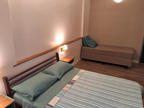 Postel nebo postele na pokoji v ubytování Suítes em casa de família com entrada independente