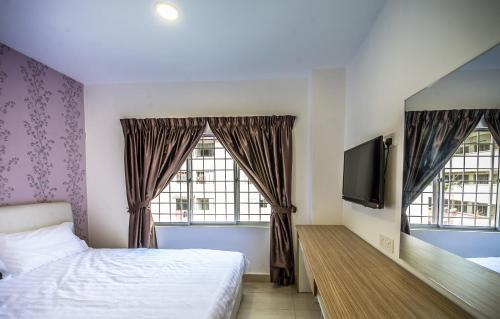 Postel nebo postele na pokoji v ubytování Crystal Garden Hotel - Seri Kembangan