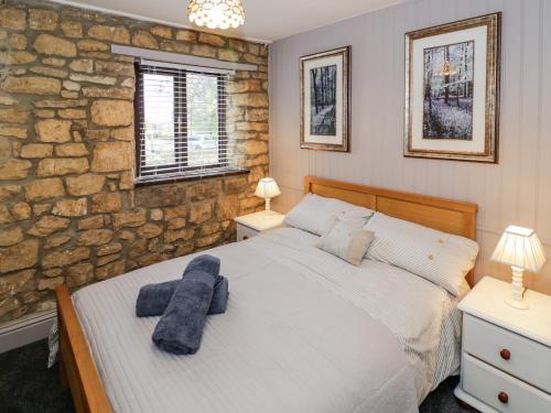 Postel nebo postele na pokoji v ubytování Bow Cottage