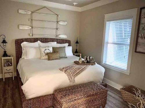 a bedroom with a large bed and a window at Fun-filled Luxury Beach Vacation Experience - Family Friendly Quiet Cul De Sac! in Bolivar Peninsula
