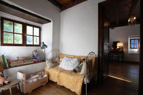 a living room with a couch and a table at Behiagoitia in Larrau