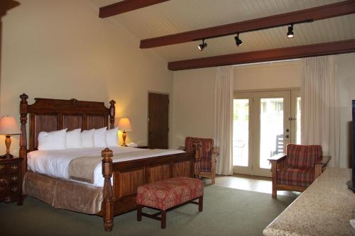 a bedroom with a large bed and a sliding glass door at Fontana Village Resort & Marina in Fontana Village