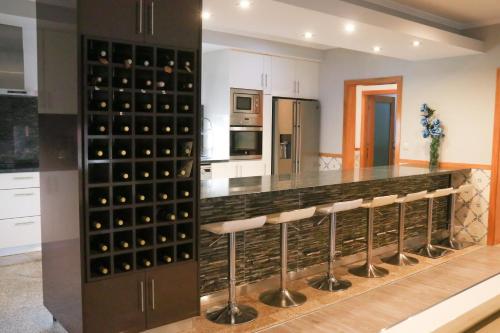 a wine cellar with a bunch of wine bottles at Turisalves- Ponte de Lima in Ponte de Lima