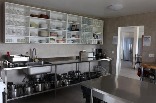 a kitchen with pots and pans on a counter at Höfn Hostel in Höfn