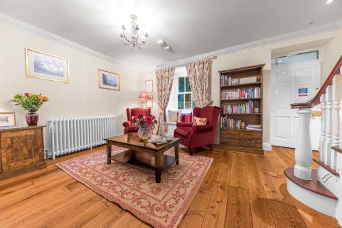 a living room with a table and two chairs at Gate House in Coniston