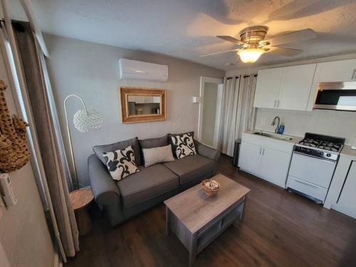 a living room with a couch and a table at Annapolis Escape Steps to Harbor backs to Gate 1 in Annapolis