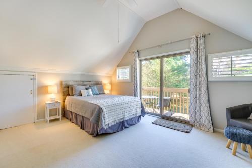 een slaapkamer met een bed en een balkon bij Lake Huron Vacation Rental with Private Beach! 