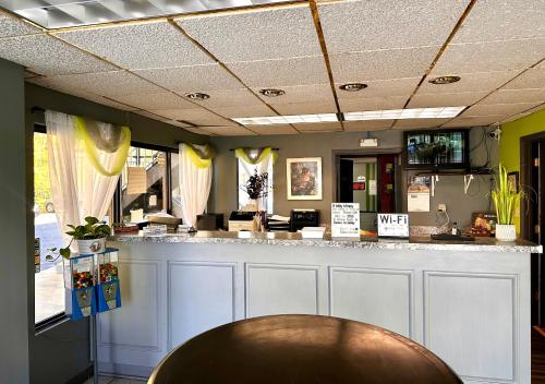 a bar in a restaurant with a wooden table at Executive Inn Chester in Chester