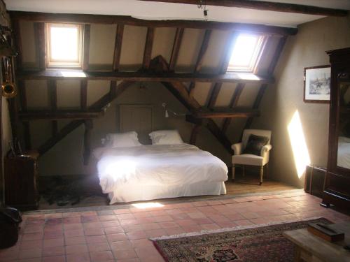 Tempat tidur dalam kamar di Gastenlogies Blauwe Schaap