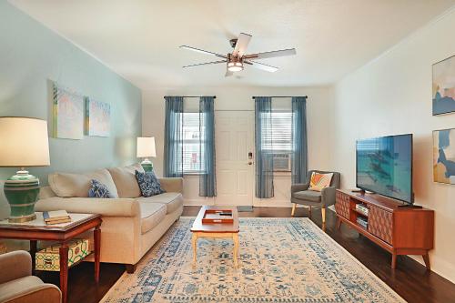 a living room with a couch and a tv at Steps to Beach & Downtown! Spacious Beach Bungalow #2 in Lake Worth