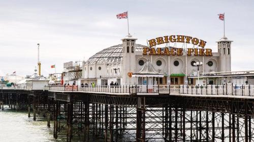 a pier with a large building on top of it at Russell Square Apartment in Brighton & Hove