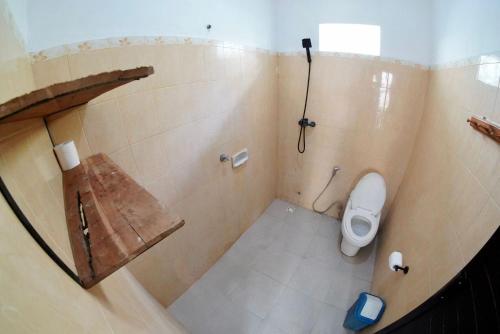 an overhead view of a bathroom with a toilet at Jepun Villas 08 - One Bedroom with 3 beds and kitchen in Uluwatu
