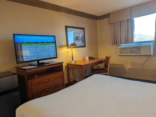Nomad Hotel & Suitesにあるテレビまたはエンターテインメントセンター