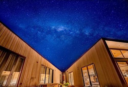 a building with a ceiling filled with stars at Kārearea Lakehouse at Lake Pukaki in Lake Pukaki