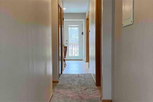 a hallway with a door leading into a room at Bass Creek's Apt A in Janesville