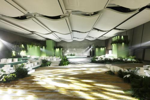 a rendering of a banquet hall with green lighting at InterContinental Chongqing Raffles City by IHG in Chongqing