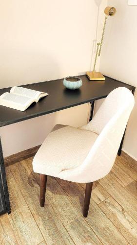 a white chair sitting in front of a desk at Luxury Home In Aguacatala in Medellín