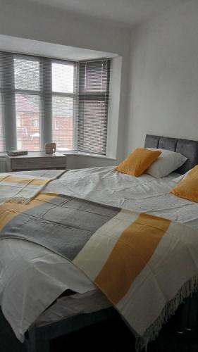 two beds sitting next to each other in a bedroom at Ribbleton Rendezvous in Preston in Preston