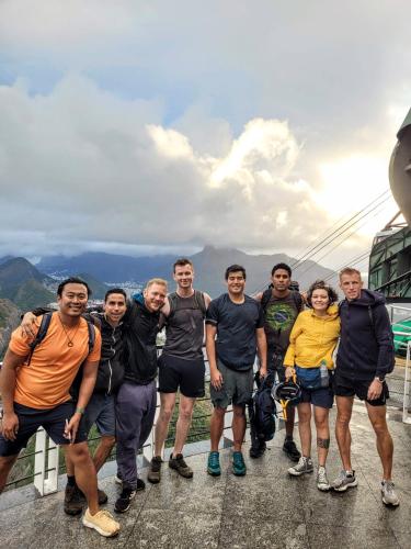 a group of people standing on the top of a mountain at Hostel Sunrise in Rio de Janeiro