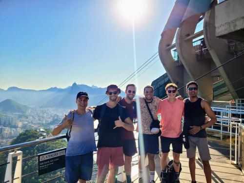 a group of men standing on top of a building at Hostel Sunrise in Rio de Janeiro