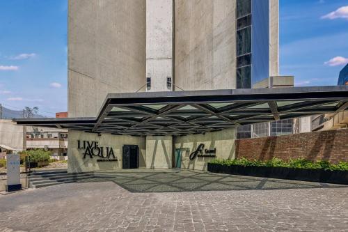 a building with graffiti on the side of it at Live Aqua Monterrey in Monterrey
