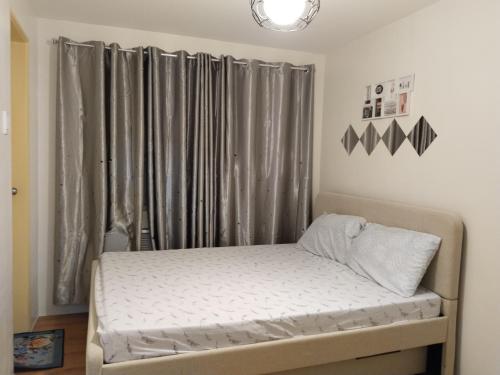 Ένα ή περισσότερα κρεβάτια σε δωμάτιο στο 7th floor Seawind Condo 2br unit near Davao Airport