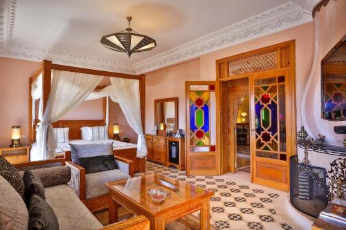 a living room with a couch and a table at Palais Amador in Oulad Mazoug