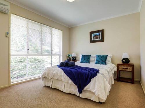 a bedroom with a bed and a large window at *Casa Al Lago* in Montville